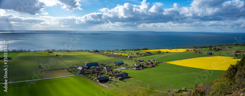Horizontal Landscape View over Agricultural colorful fields seen from the Medieval Castle Brahehus a Famous landmark in Sweden By the Big lake Vattern near Granna in Smaland, Sweden. photo