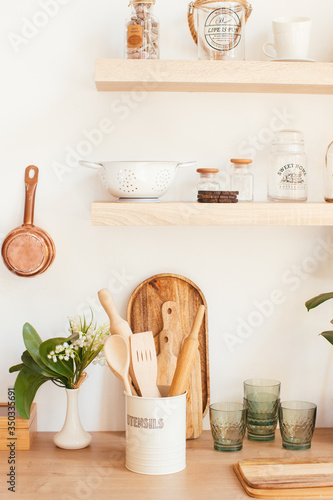 wooden rustic kitchen table. minimalistic interior, utencils on the table