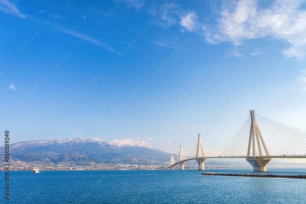 The famous cable bridge Charilaos Trikoupis in Rio Antirio Greece on a sunny day with a blue sky