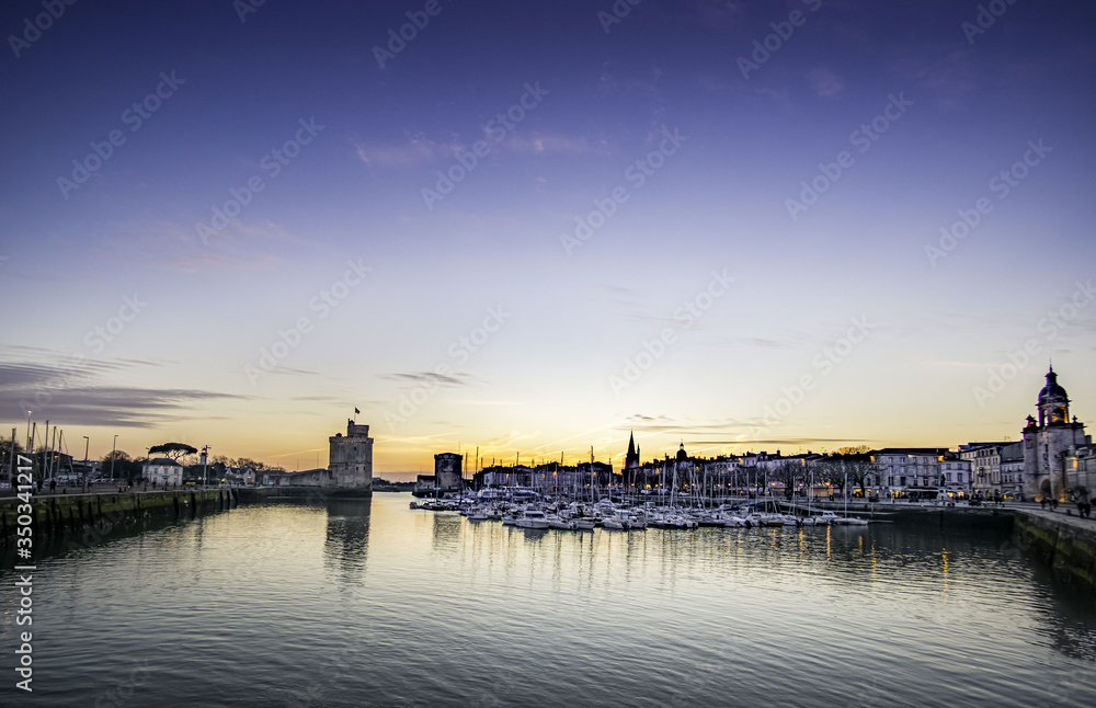 Old harbour of La Rochelle, France at sunset