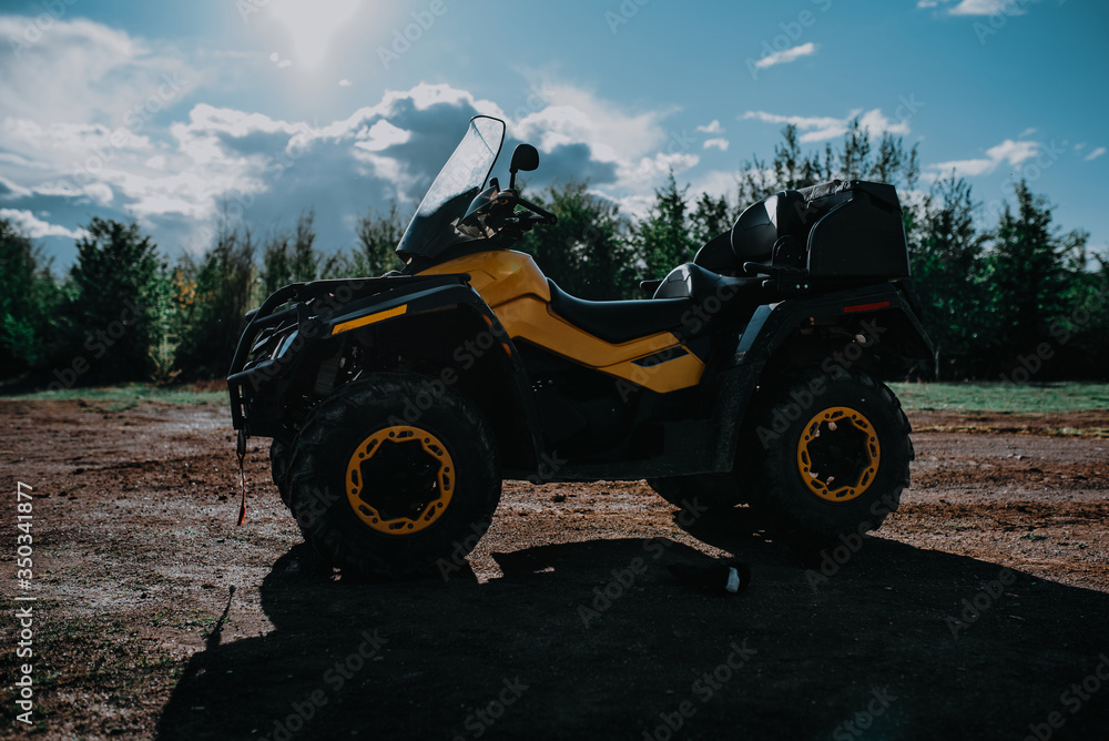 Fototapeta premium Yellow atv, quad in forest