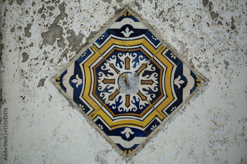 Traditional old tiles wall on the Porto streets, painted tin-glazed, azulejos ceramic tilework.