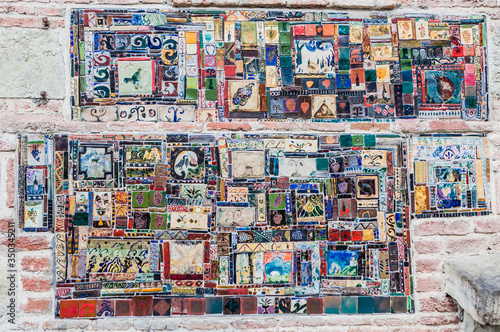 The mosaic on the wall of the Tbilisi theater Rezo Gabriadze. Tbilisi, Georgia