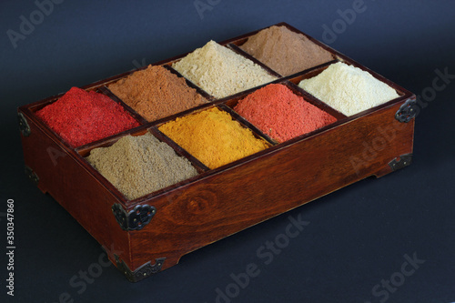 Vintage wooden box with a set of spices