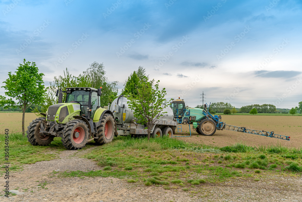 tween chemistry into the tanks of the tractor when spraying plants in the field tween chemistry into the tanks of the tractor when spraying plants in the field