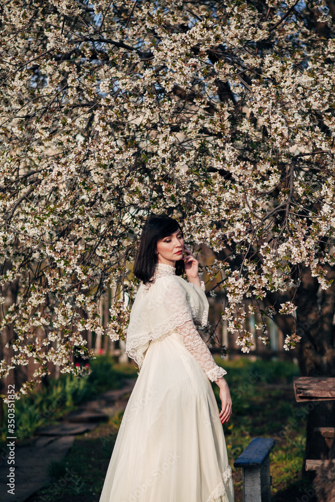 woman in white spring blossoms