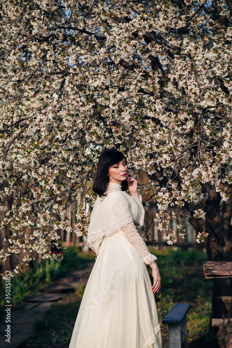 woman in white spring blossoms