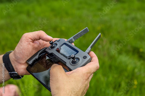 Drone controller, on a background of grass.