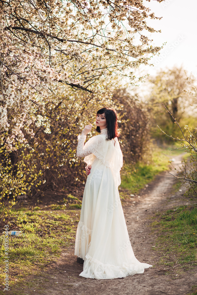 girl next to a flowering tree
girl next to a flowering tree