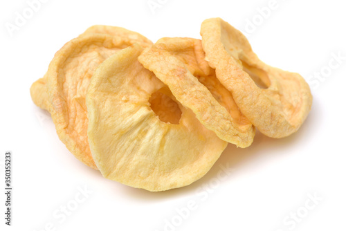 dried apple slices on white background .