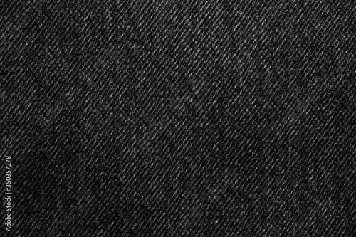 Dark jeans denim textile macro background