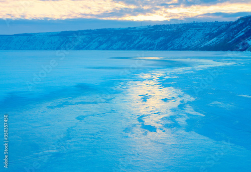 light reflection in the frozen lake , winter morning scene