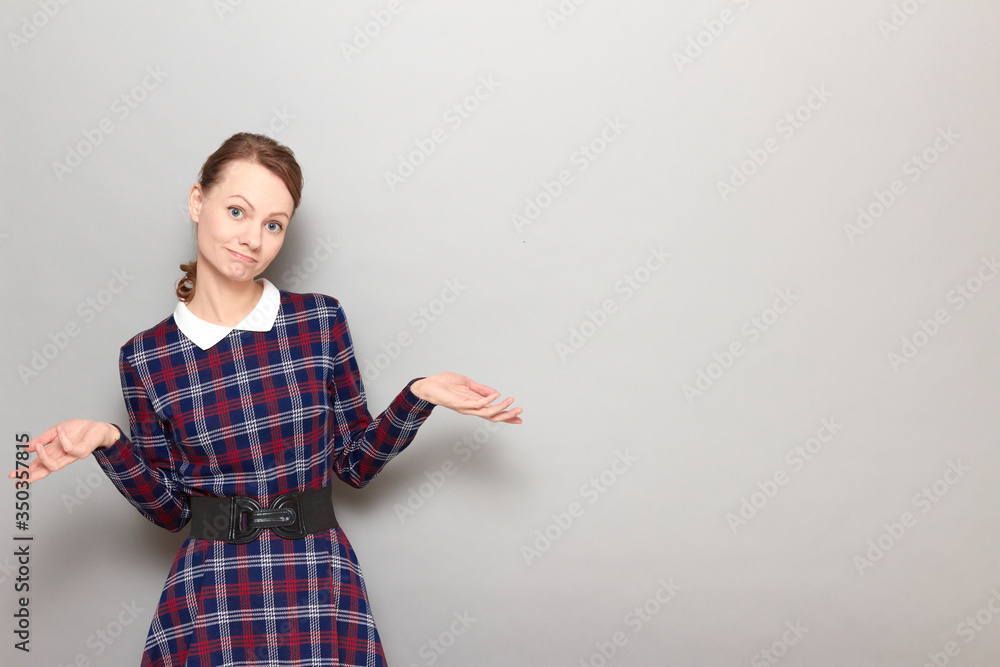 Portrait of disappointed girl shrugging shoulders and raising hands Portrait of disappointed girl shrugging shoulders and raising hands