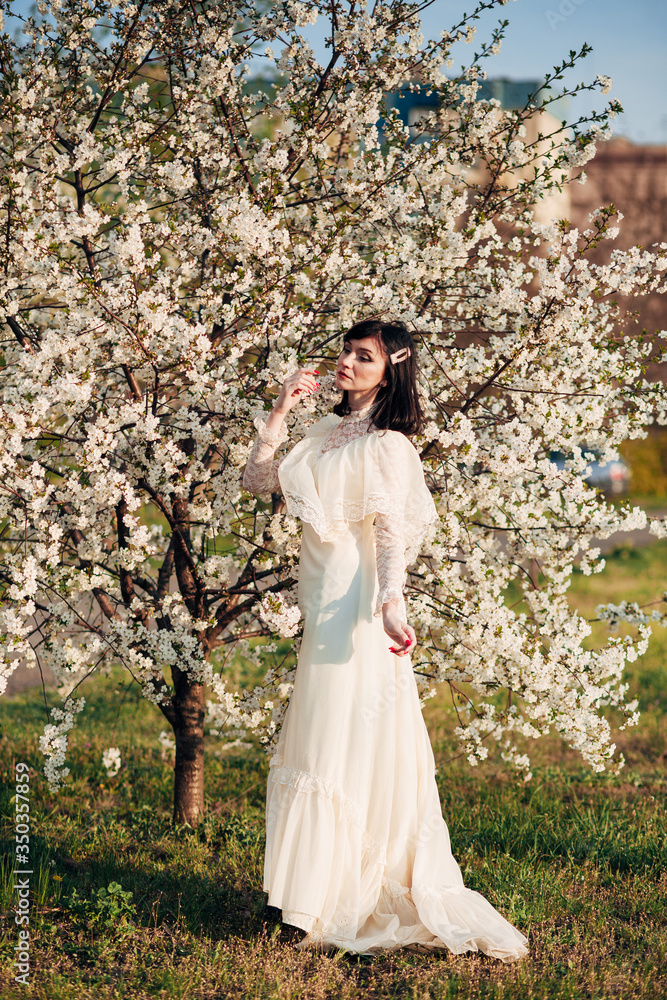 girl near a flowering spring tree