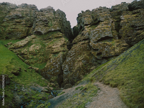 stone wall with moss-covered rocks, Rauðfeldsgjá gorge photo