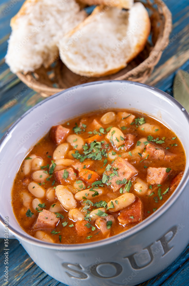 Baked beans in tomato sauce with chopped sausage Baked beans in tomato sauce with chopped sausage