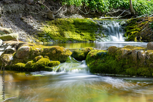 Fototapeta Naklejka Na Ścianę i Meble -  Series of waterfalls in lush spring forest, Sweden