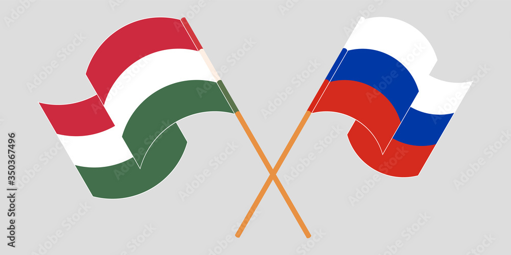 Crossed and waving flags of Hungary and Russia Crossed and waving flags of Hungary and Russia