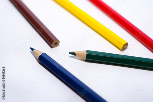 colored pencils on a white background
