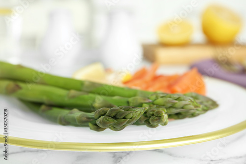 Closeup view of tasty asparagus on plate