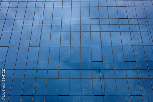 Glass facade of a modern office building.