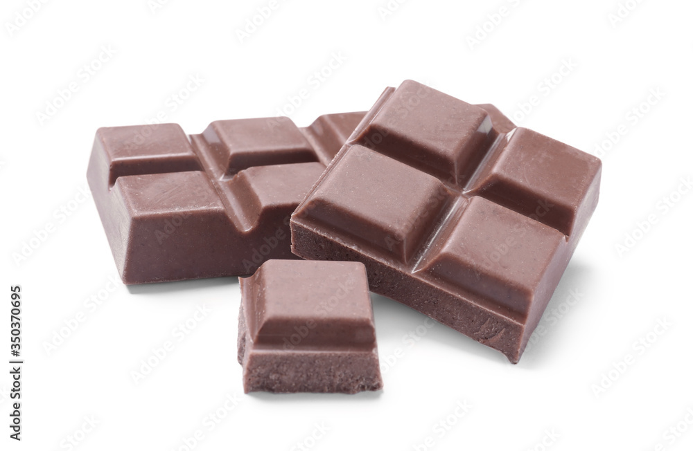 Pieces of delicious milk chocolate isolated on white Pieces of delicious milk chocolate isolated on white