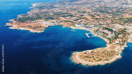 Aerial panorama of Cyprus coastline with beaches, bay and hotels. Travel concept.