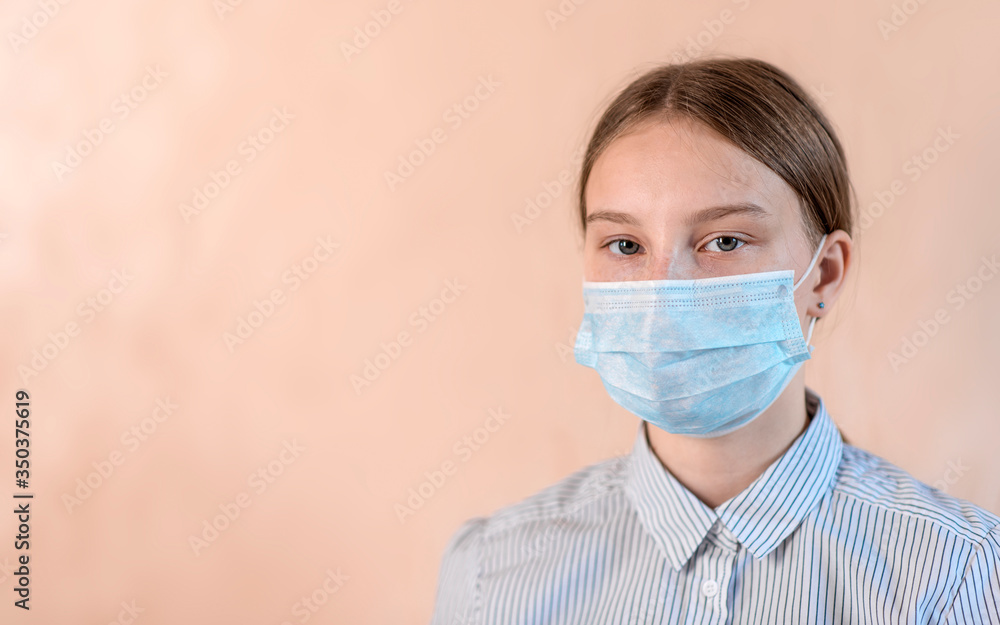 Close-up portrait, teenage girl in protective medical mask, free space copy text poster, stay home. Prevent coronavirus infectious pandemic. Horizontal photo banner for website header design Close-up portrait, teenage girl in protective medical mask, free space copy text poster, stay home. Prevent coronavirus infectious pandemic. Horizontal photo banner for website header design