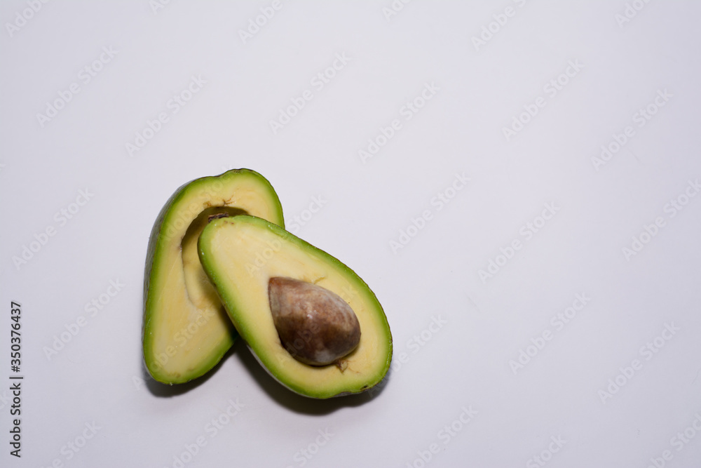 avocado cut in half  on white background