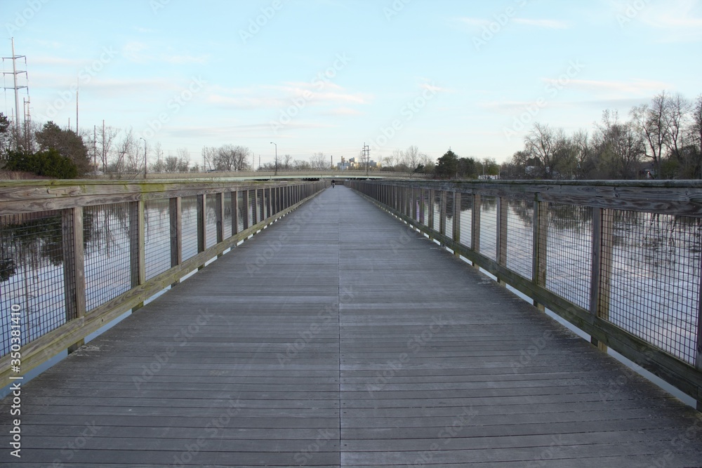 Naklejka premium wooden bridge over the lake