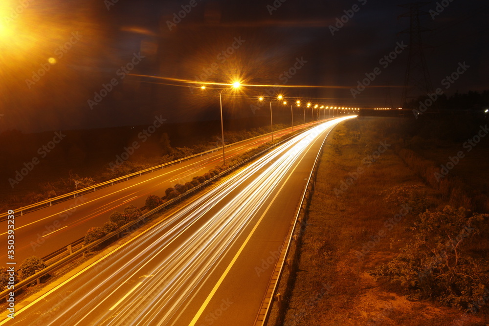 a highway at a night with long expose a highway at a night with long expose