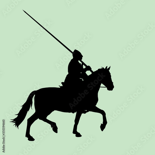 black silhouette of a medieval knight with a spear on a horse in a field, trotting, isolated image on the background of the dawn sky
