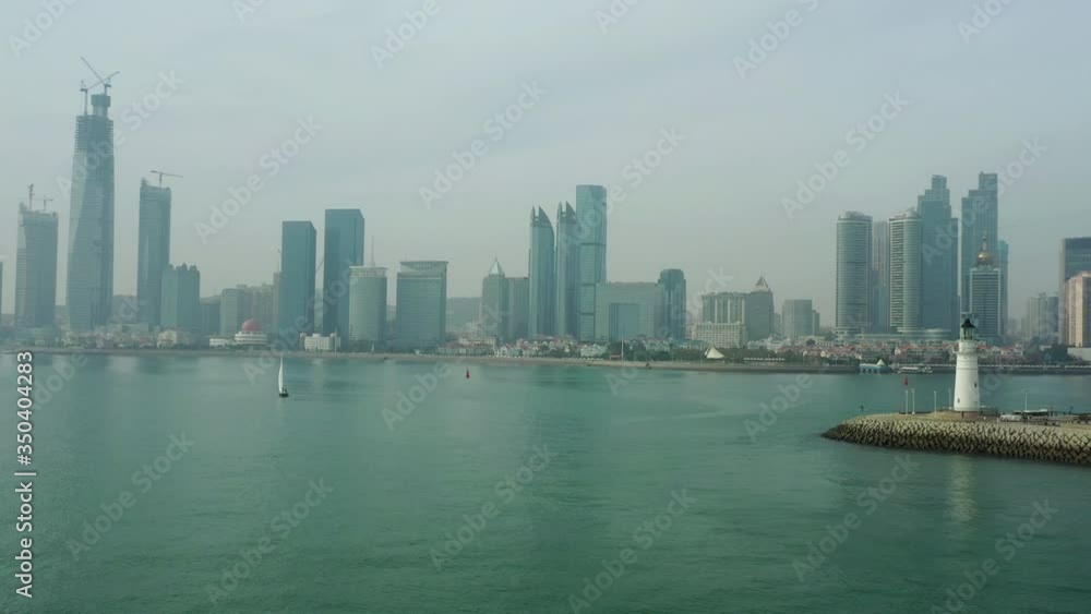 sunny day qingdao city bay construction famous light house pier aerial panorama 4k china