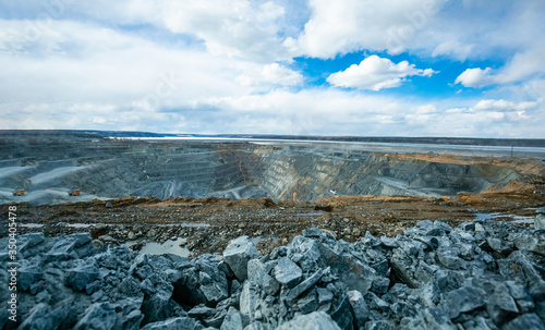 Open pit mining  work of excavators and dump trucks