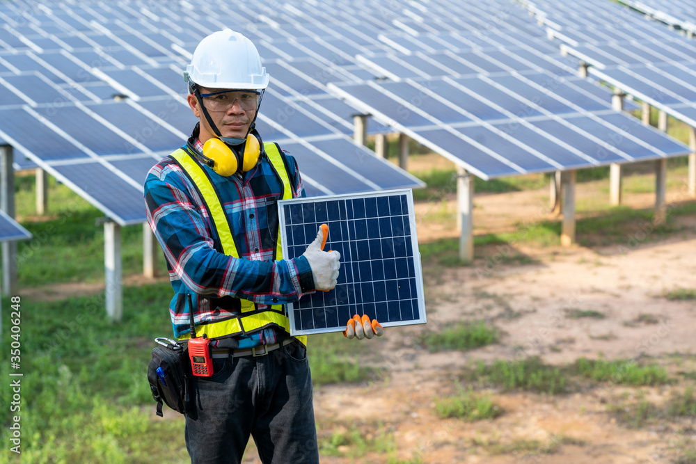 Engineer checking solar panel in routine operation at solar power plant,Solar power plant to innovation of green energy for life adjustment. Engineer checking solar panel in routine operation at solar power plant,Solar power plant to innovation of green energy for life adjustment.