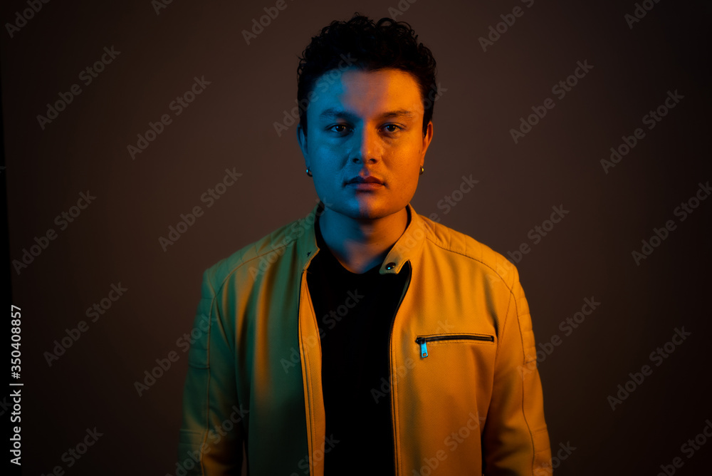 Obraz premium Young handsome man posing and playing guitar