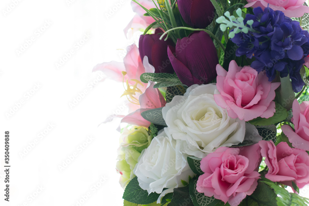 Beautiful colorful decoration artificial flower isolated on white background.