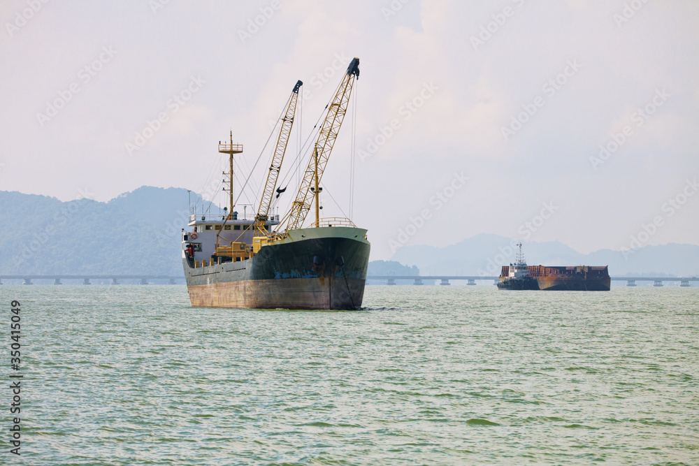 Cargo ships sailing across the sea