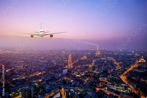 Real airplane over the Cityscpae with the view of Eiffel Tower Paris, France photo