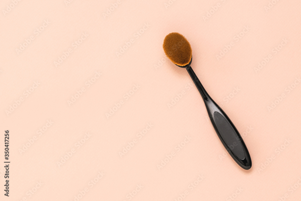 Makeup brush on a light pastel background. Makeup brush on a light pastel background.