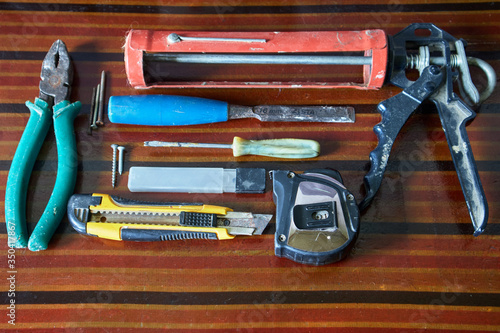 Various work tools on a brown table