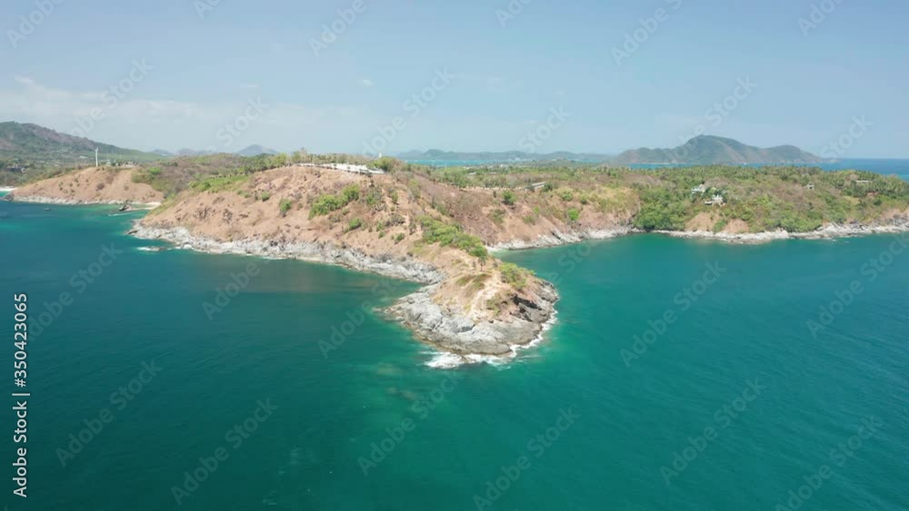 Aerial view drone shot of Laem Promthep Cape and beautiful scenery Andaman sea in Phuket, Thailand.
Aerial view drone shot of Laem Promthep Cape and beautiful scenery Andaman sea in Phuket, Thailand.
