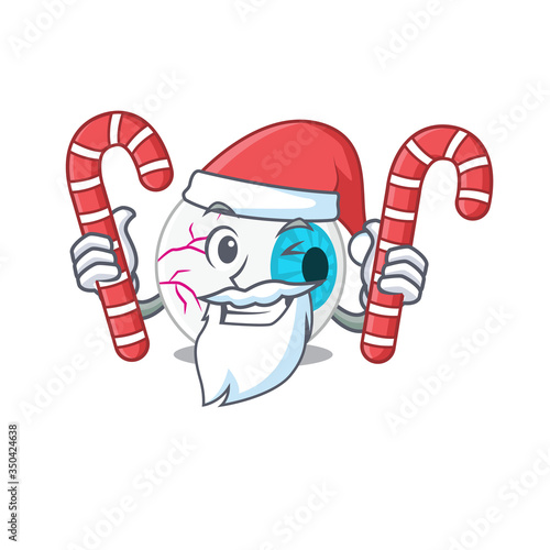 Friendly eyeball dressed in Santa Cartoon character with Christmas candies