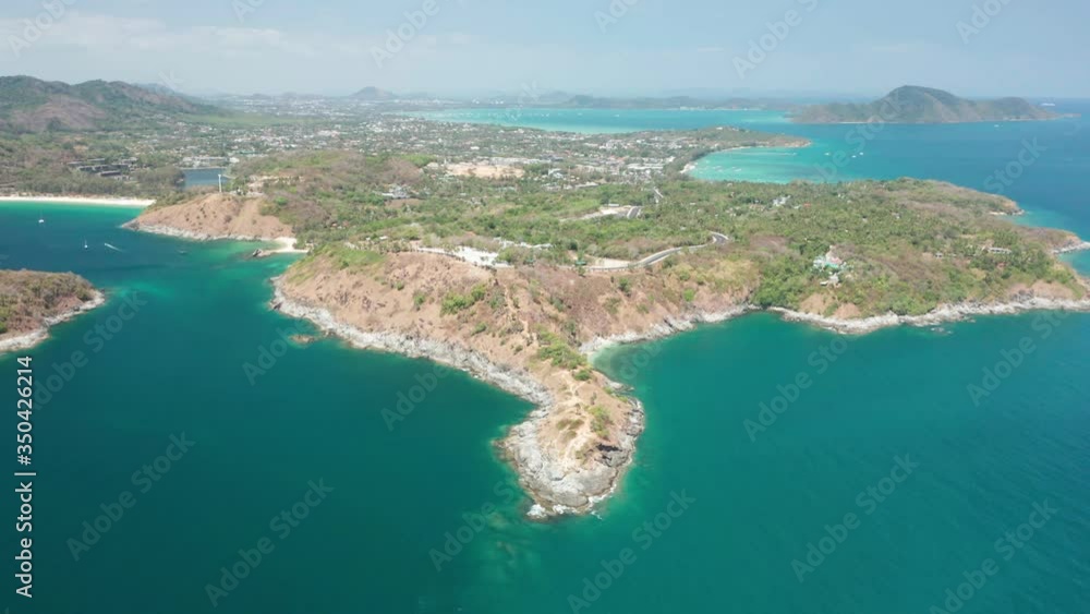 Aerial view drone shot of Laem Promthep Cape and beautiful scenery Andaman sea in Phuket, Thailand.
Aerial view drone shot of Laem Promthep Cape and beautiful scenery Andaman sea in Phuket, Thailand.