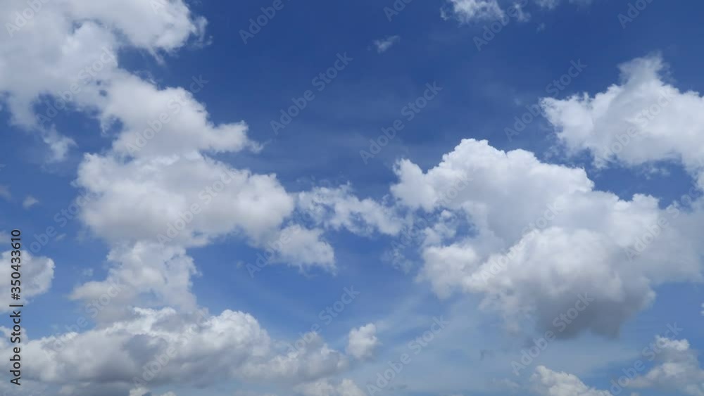 Beautiful sunny blue sky background with Puffy fluffy cumulus cloud & white cotton candy cloudscape in tropical summer or spring morning sunlight & daylight sun rays at sunshine day, b-roll TimeLapse Beautiful sunny blue sky background with Puffy fluffy cumulus cloud & white cotton candy cloudscape in tropical summer or spring morning sunlight & daylight sun rays at sunshine day, b-roll TimeLapse