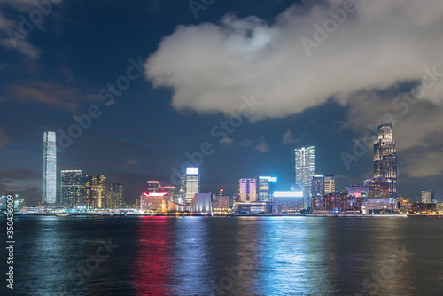 Skyline and harbor of Hong Kong city at night