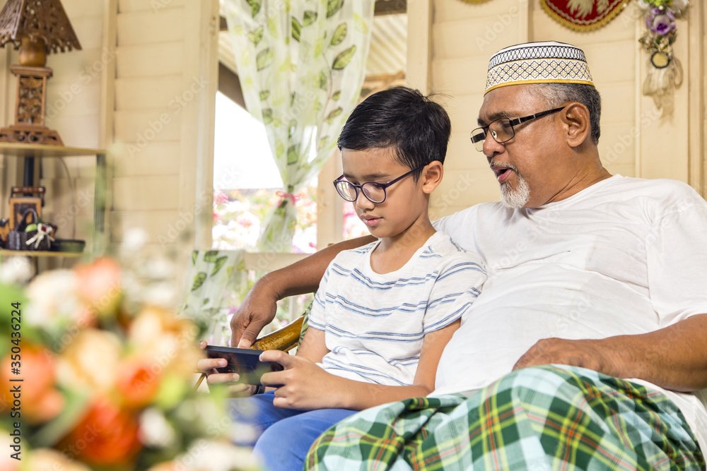 Senior man and boy spending time together Senior man and boy spending time together