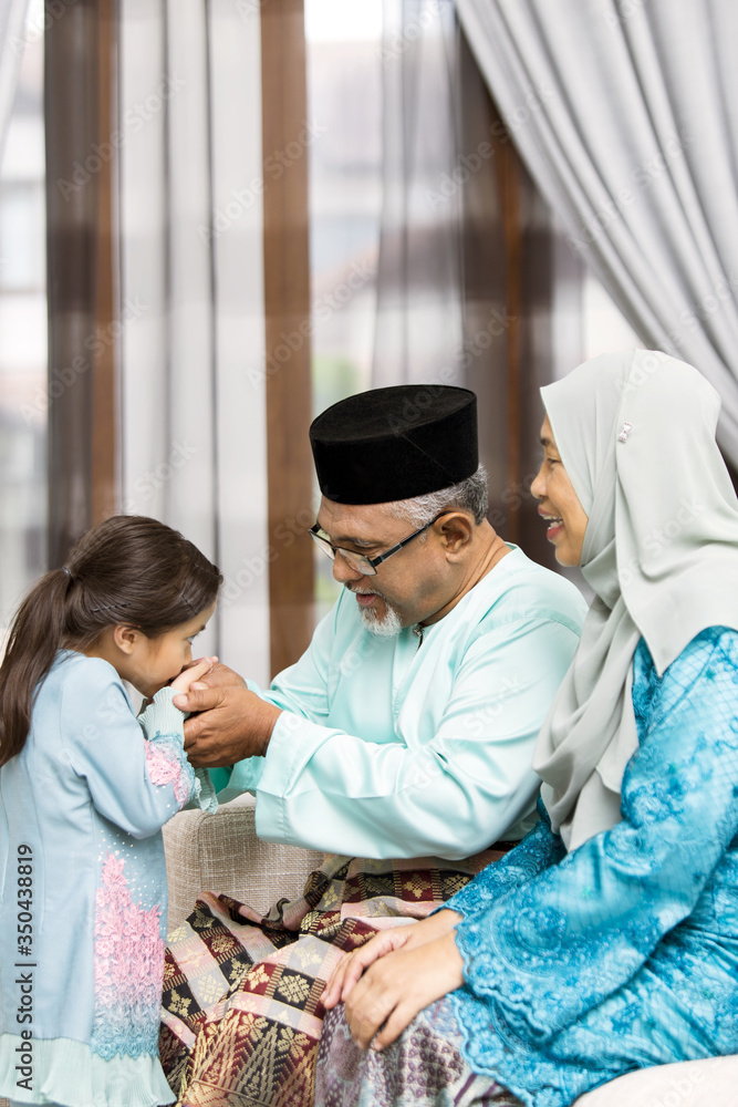 custom made wallpaper toronto digitalTraditional act of respect in Muslim family on Eid al-Fitr