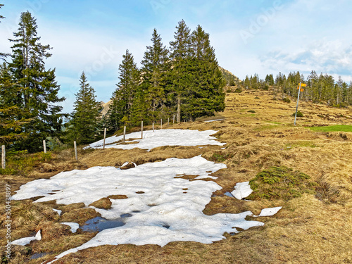 The early spring atmosphere with the last remnants of winter and snow on the slopes of the Pilatus mountain range, Alpnach - Canton of Obwalden, Switzerland (Kanton Obwalden, Schweiz) photo