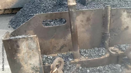 Asphalt paving materials with machines And there is haze from the heat of the material